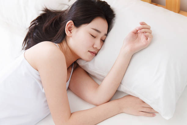 istock Young women sleep in their bedrooms 1204170419