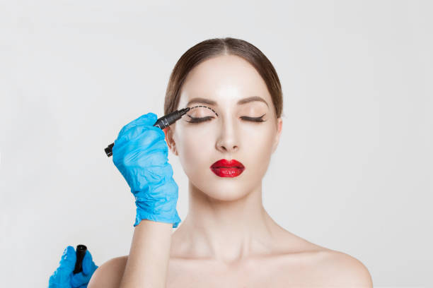 upper eyelid reduction double eye lid removal plastic surgery cosmetic operation concept woman eyes closed  doctor surgeon hand in gloves drawing cut line eyelid fat isolated white grey background - human hand pencil women sketching imagens e fotografias de stock