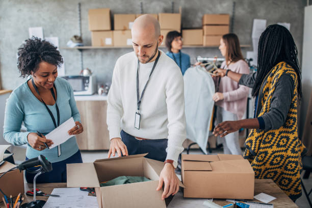 istock Diverse group of people arranging customers orders for drop shipping 1204172297