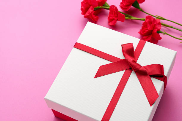 istock Mothers day gift and carnation flower. 1204172303