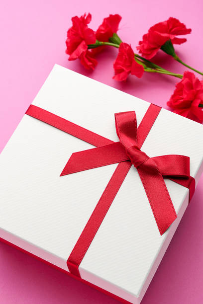 istock Mothers day gift and carnation flower. 1204172348
