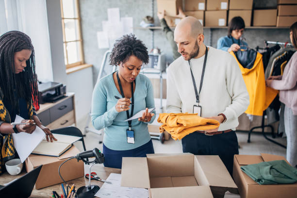 istock Diverse group of people arranging customers orders for drop shipping 1204172353