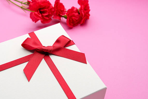 istock Mothers day gift and carnation flower. 1204172386