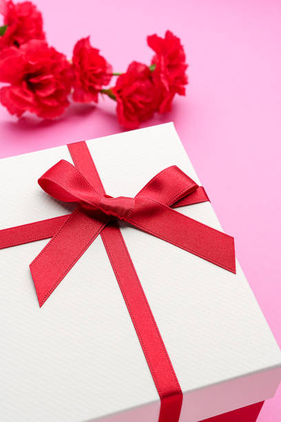 istock Mothers day gift and carnation flower. 1204172403
