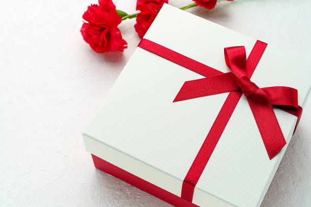 istock Mothers day gift and carnation flower. 1204172418