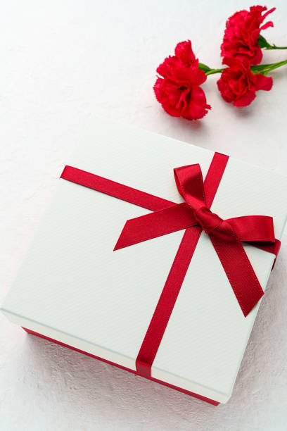 istock Mothers day gift and carnation flower. 1204172438