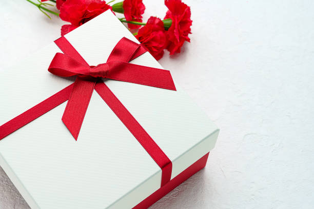 istock Mothers day gift and carnation flower. 1204172458