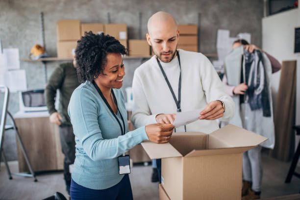 istock Diverse group of people arranging customers orders for drop shipping 1204172686