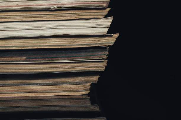 istock Close up old journals on a black background. 1204175732