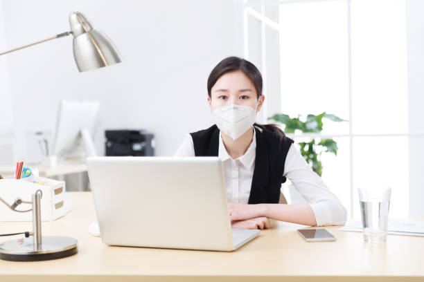 istock A business woman wearing a mask 1204175804