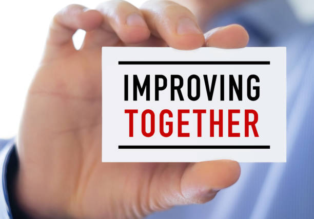 istock Improving Together - business card concept 1204176223