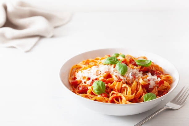 istock tagliatelle pasta with tomato sauce parmesan basil 1204177989