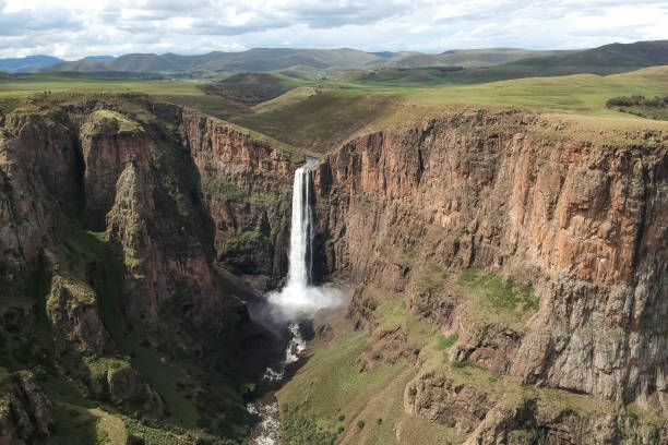 istock horizontal shot of stunning waterfall running down a steap canyon 1204178787