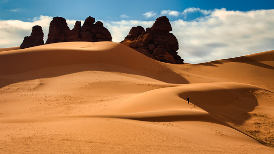 The Acacus Mountains or Tadrart Akakus form a mountain range in the desert of the Ghat District in western Libya, part of the Sahara. They are situated east of the city of Ghat, Libya, and stretch north from the border with Algeria, about 100 kilometres. The area has a particularly rich array of prehistoric rock art.