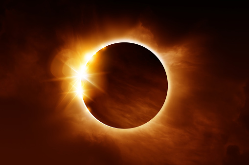 A solar eclipse. The total eclipse is caused when the sun, moon and earth align. Illustration.