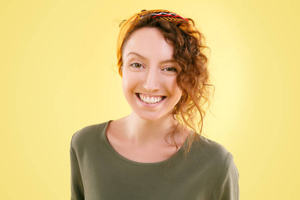 istock Young beautiful curly woman is smiling positively 1204181910