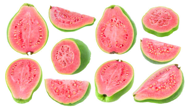 Isolated pink fleshed guava pieces Isolated guava pieces. Collection of cut green pink fleshed guava fruits of different shapes isolated on white background with clipping path guava photos stock pictures, royalty-free photos & images