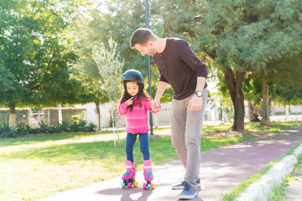 istock Girl Learning To Skate At Park 1204183318