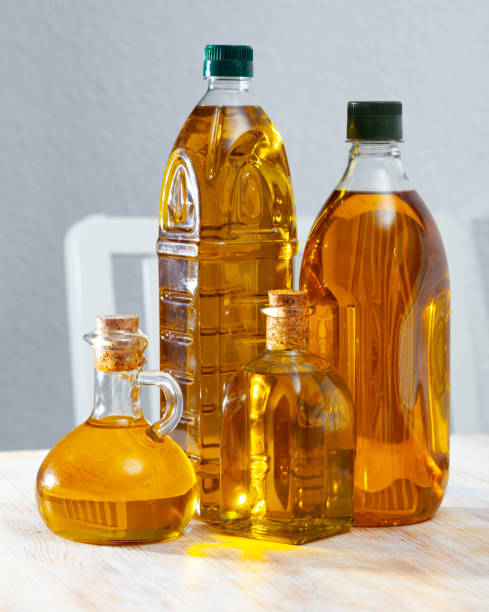 istock Vegetable oil on wooden table 1204183520
