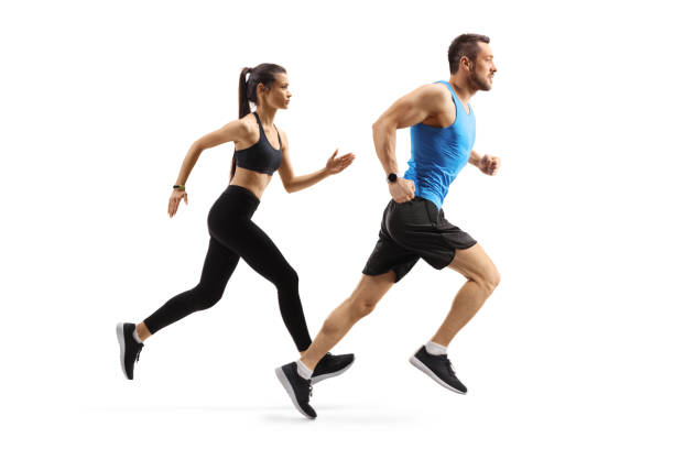 Fit man and woman in sportswear running Full length profile shot of fit man and woman in sportswear running isolated on white background sportsman professional sport side view horizontal stock pictures, royalty-free photos & images