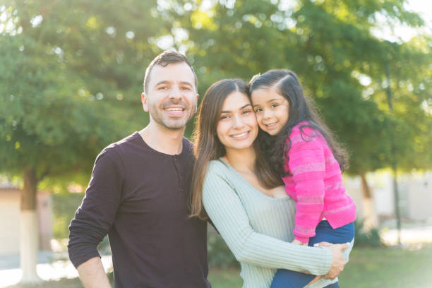 istock Happy Family Spending Leisure Time At Park 1204185466