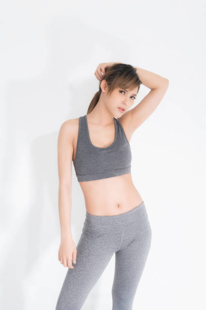 istock Young women in gray exercise clothes 1204185870