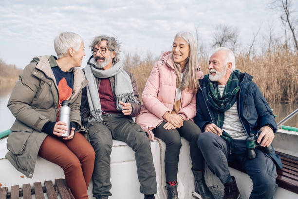 istock Senior friends sitting on the boat and talking 1204189067