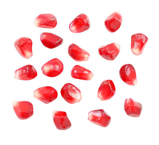 istock Pomegranate seeds are separated, red fruit isolated on white background with clipping path. Full depth of field. 1204189519