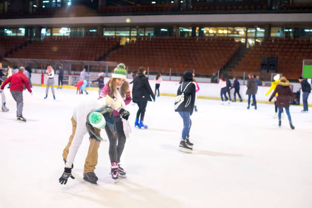 istock Young couple ice skating in winter 1204189638