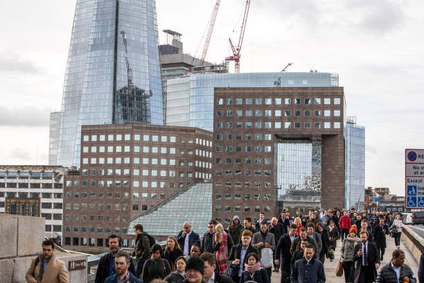 istock Londoner commuter crowd in London Bridge 1204189713