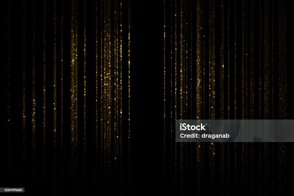 Golden curtain Gold glittering threads on black background Gold - Metal Stock Photo