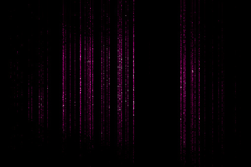 Purple glittering threads on black background