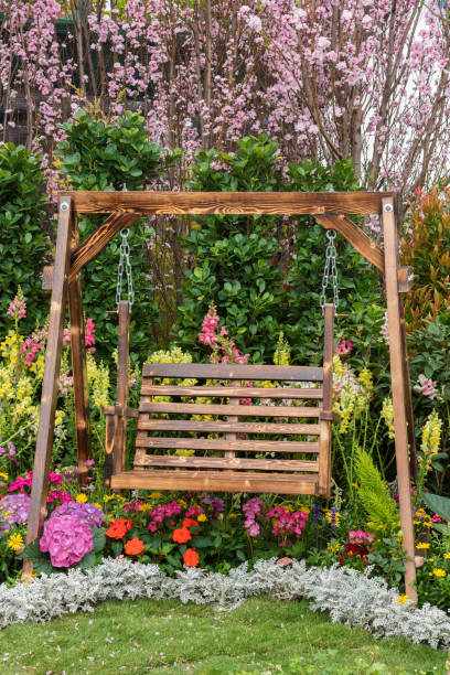 istock seat in flower garden 1204196533