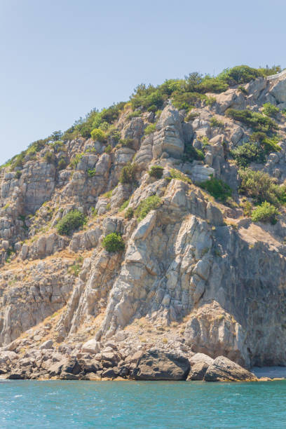 istock Mountains and rocks on the beach in summer on a Sunny day 1204200255