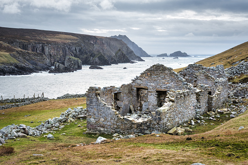 The ruins of an old famine stone built cottage on a remote part of the Irelands west coast in County Donegal