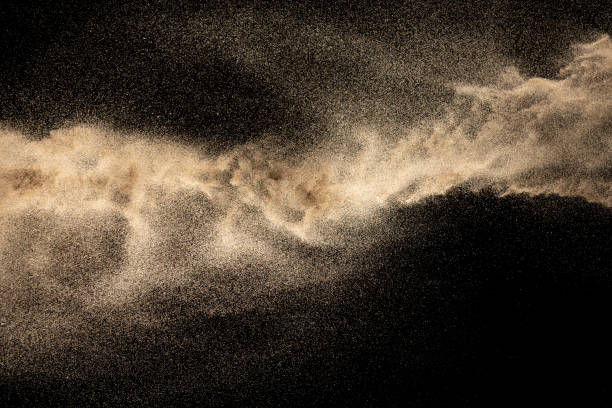 istock Brown dry river sand explosion isolated on black background. Abstract sand splash. 1204200682