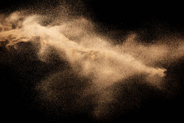 istock Brown dry river sand explosion isolated on black background. Abstract sand splash. 1204200718