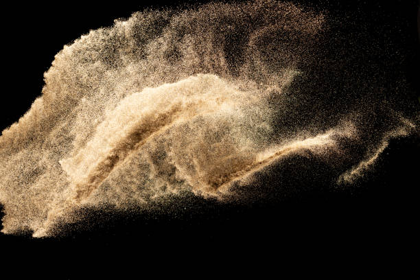istock Brown dry river sand explosion isolated on black background. Abstract sand splash. 1204200723