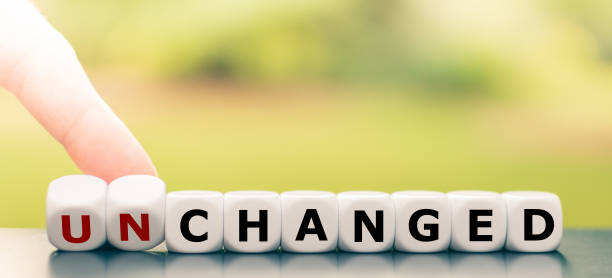 istock Hand turns dice and changes the word 