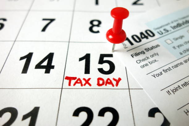 istock Calendar showing date April 15 2020 with 1040 form 1204201169