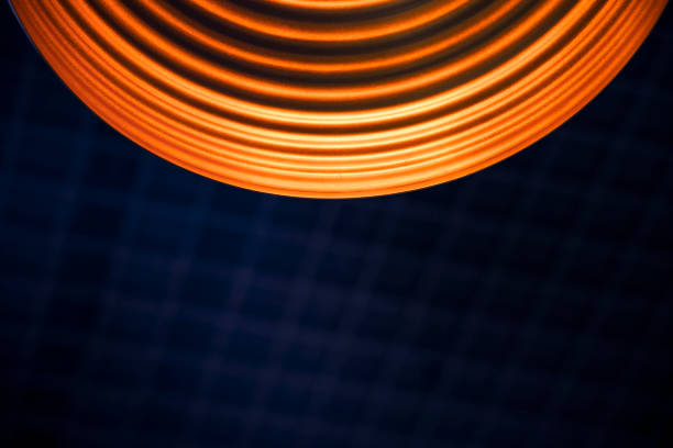 istock abstract interior roof view inside circle lamp geometry shape orange illumination and dark blue grid background copy space for your text here 1204204025