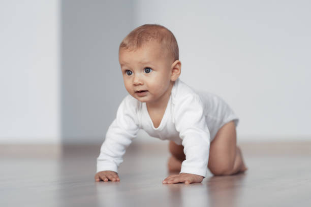 istock The kid is trying to take his first steps 1204205571