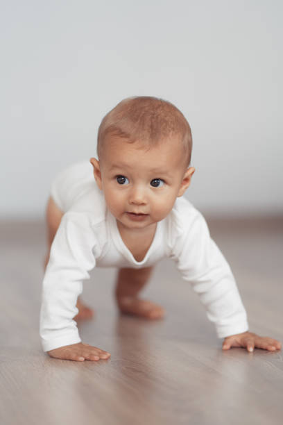 istock The kid is trying to take his first steps 1204205572