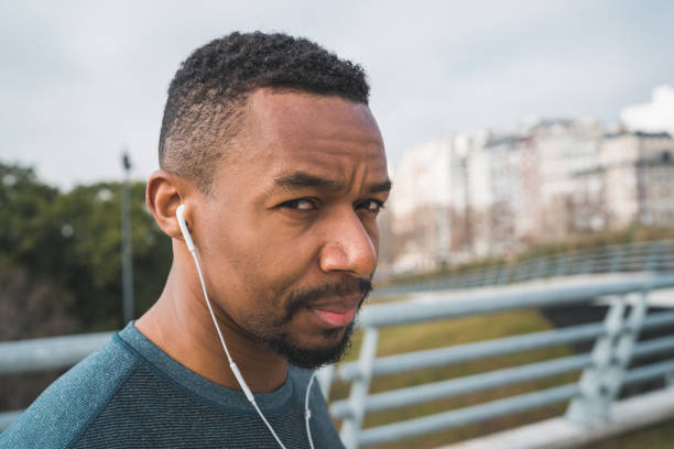 istock Athletic man listening to music. 1204205891