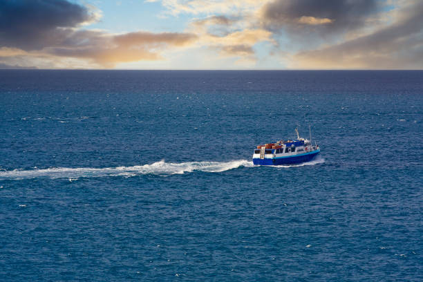 istock Blue Ferry Across Blue at Sunrise 1204208290