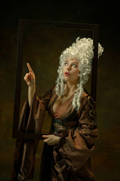istock Medieval young woman in old-fashioned costume 1204211455