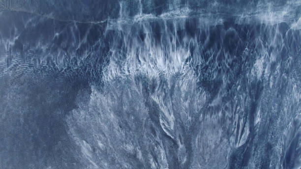 istock Background of frozen ice in dark blue 1204214882