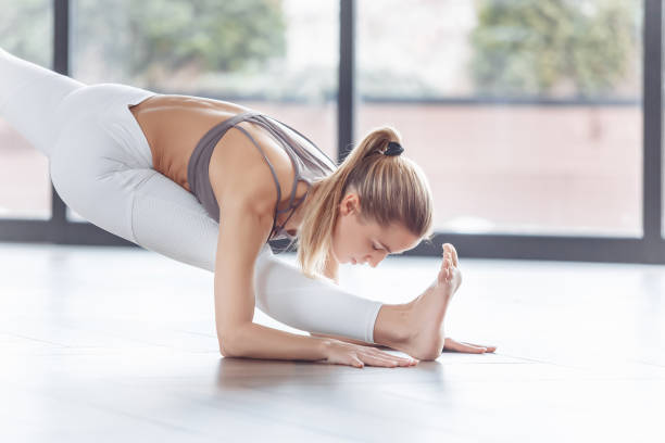 istock female Performing aero yoga in class 1204215043