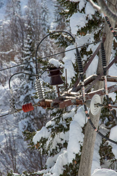 istock Electrical cables covered in snow, close up 1204216127