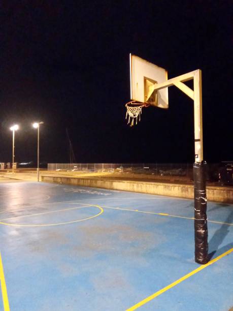 istock Basketball hoop at night by Beach Brighton UK 1204220045